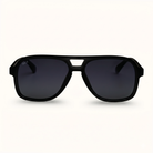 Black sunglasses with dark lenses on a white background