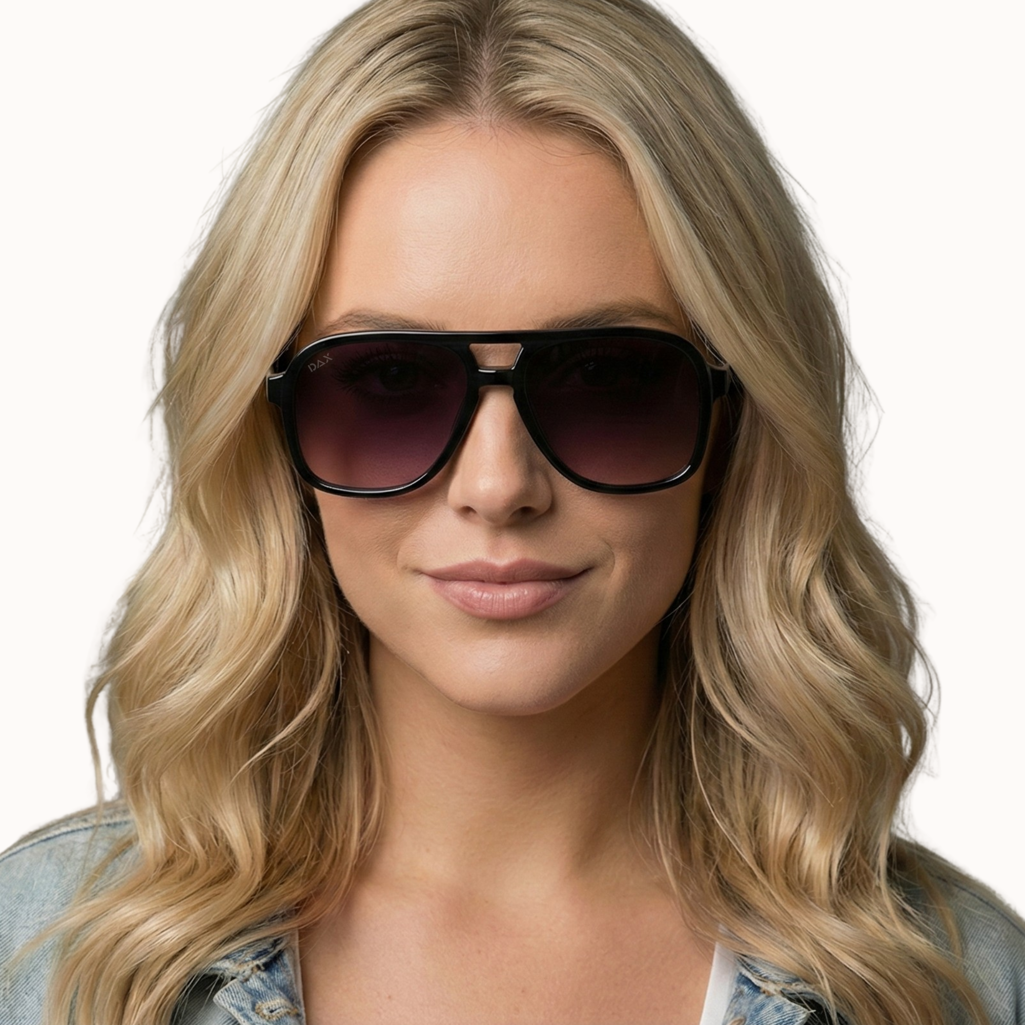 Woman wearing sunglasses with a neutral background
