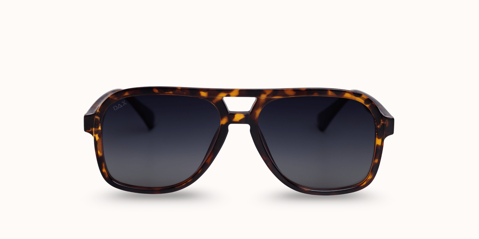 Sunglasses with tortoise shell frame and dark lenses on a white background