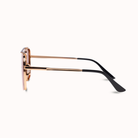 A pair of square-frame sunglasses shown in side profile on a clean white background. The frames are made of rose gold metal, with black temple arms and black temple tips.
