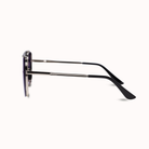 A pair of black acetate sunglasses with dark lenses, shown from a side profile view on a clean white background.