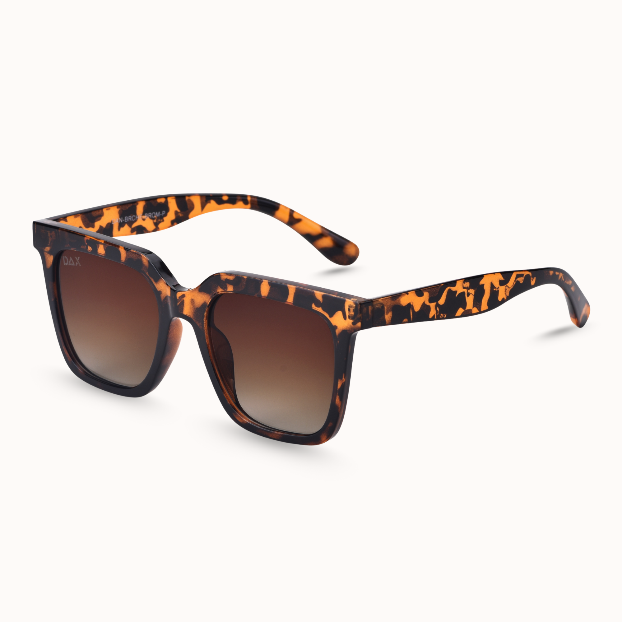Sunglasses with cheetah frame and brown lenses on a white background