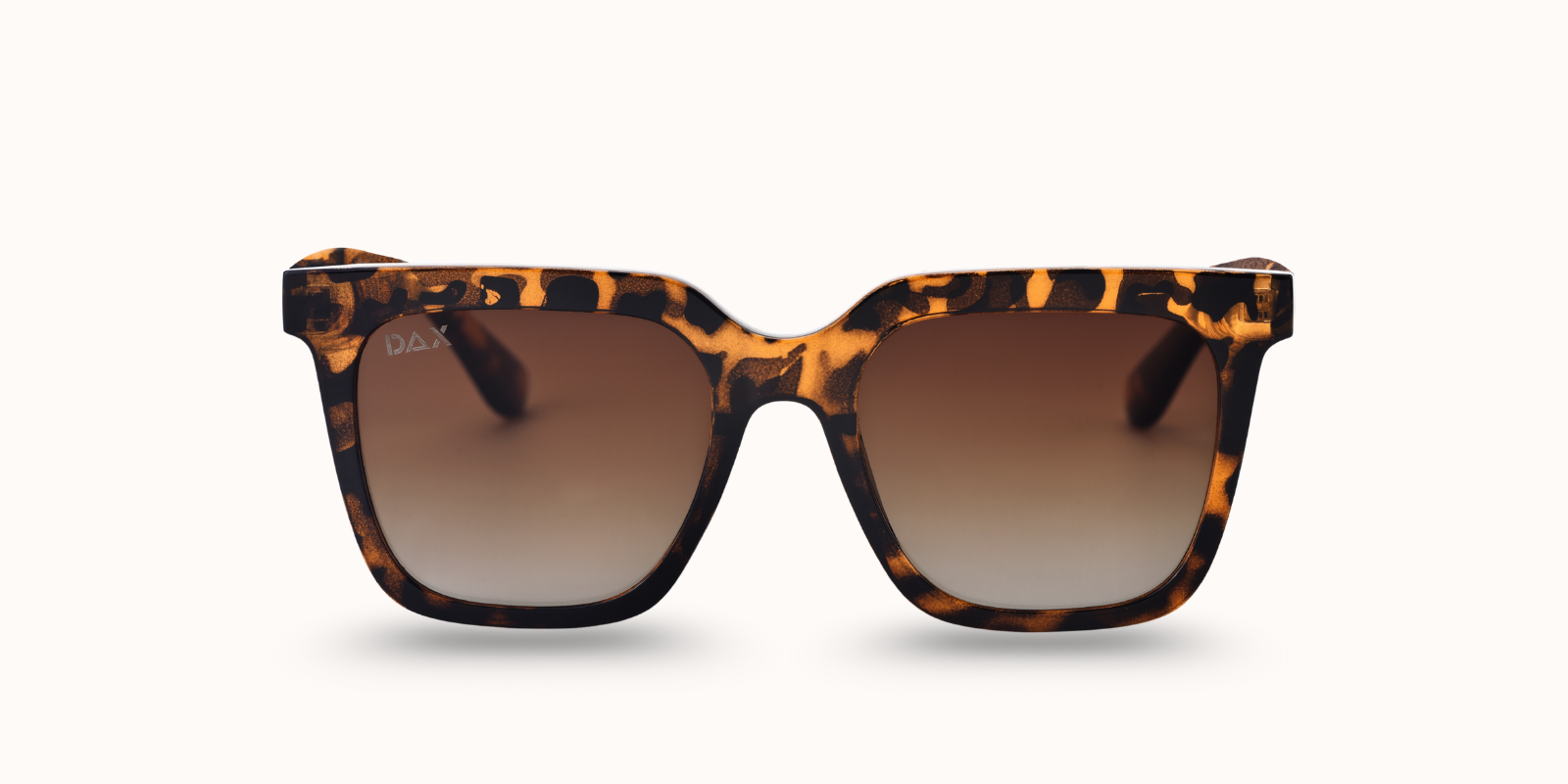 Sunglasses with a brown cheetah frame and gradient lenses on a white background
