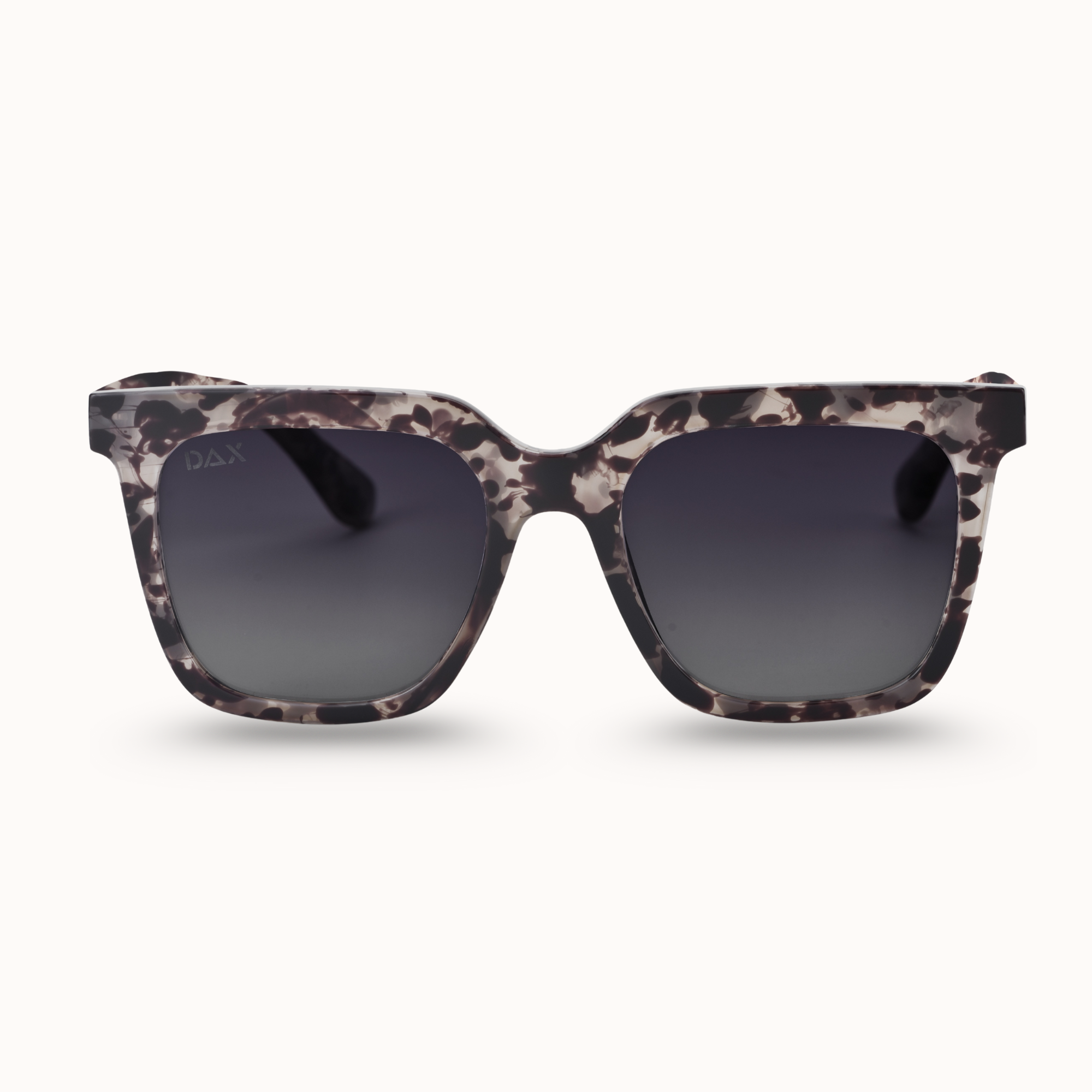 Sunglasses with gray cheetah patterned frame on a white background