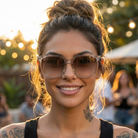 Woman wearing sunglasses with a blurred outdoor background