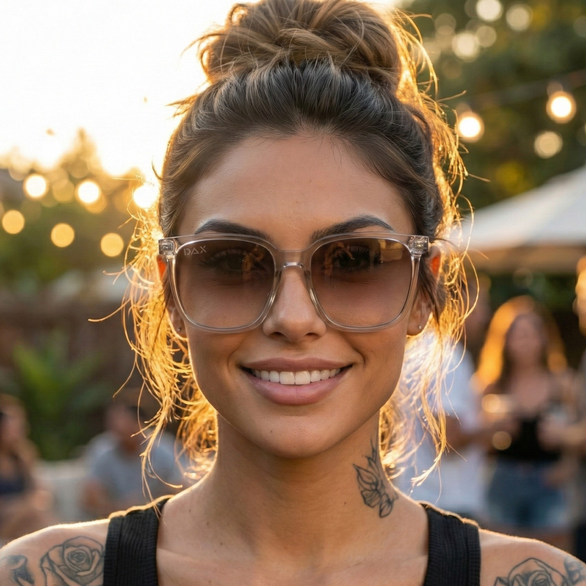 Woman wearing sunglasses with a blurred outdoor background
