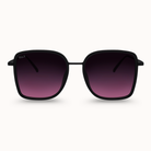 Black sunglasses with gradient purple lenses on a white background
