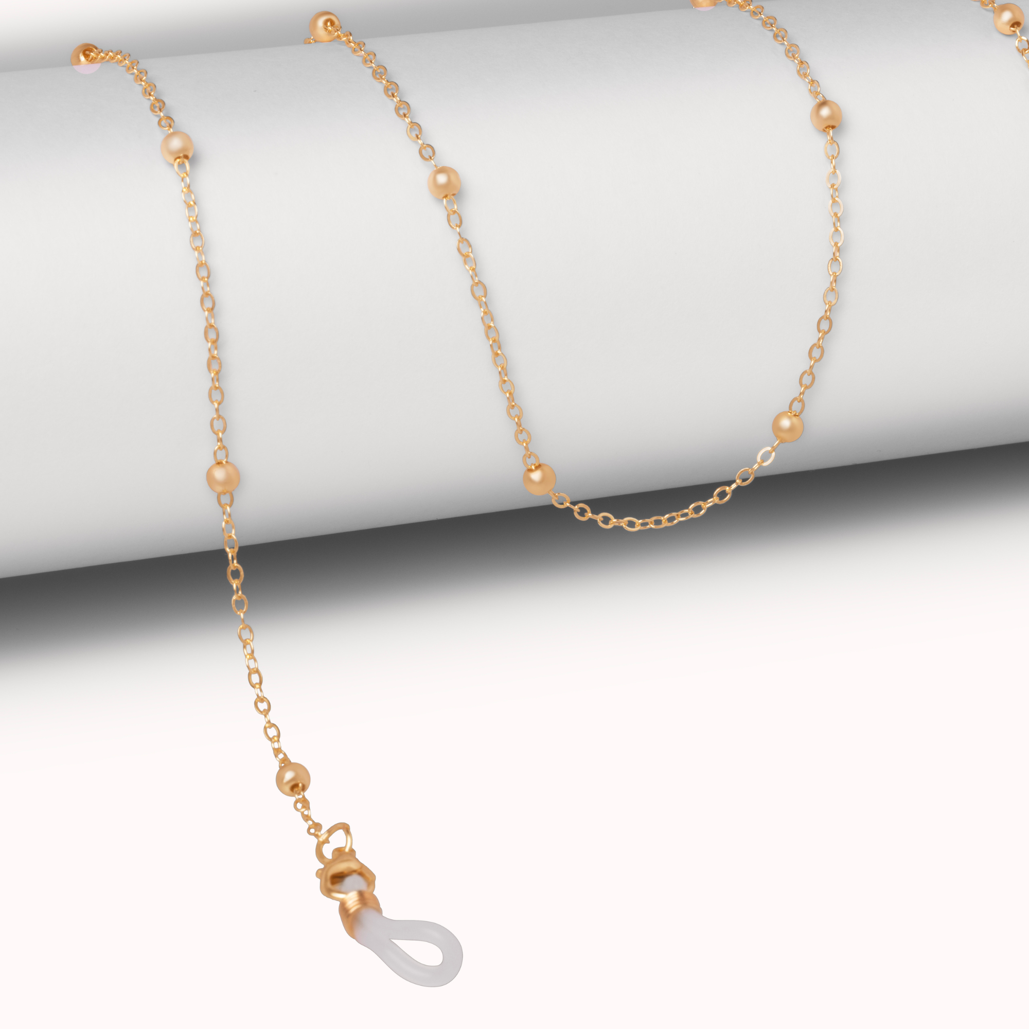 Gold necklace with a clasp on a white background