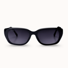Black sunglasses with dark lenses on a white background