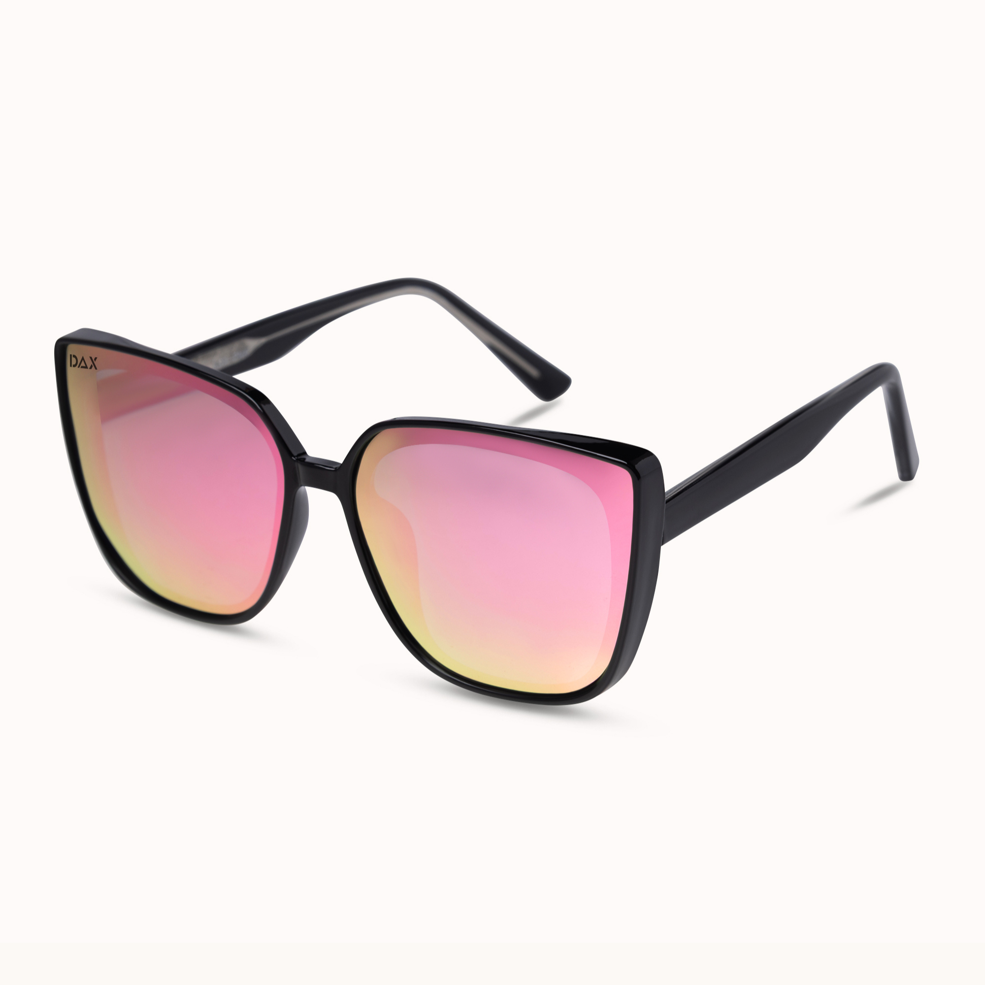 A pair of oversized square sunglasses with a glossy black frame and mirrored pink-to-yellow gradient lenses, shown on a clean off-white background.