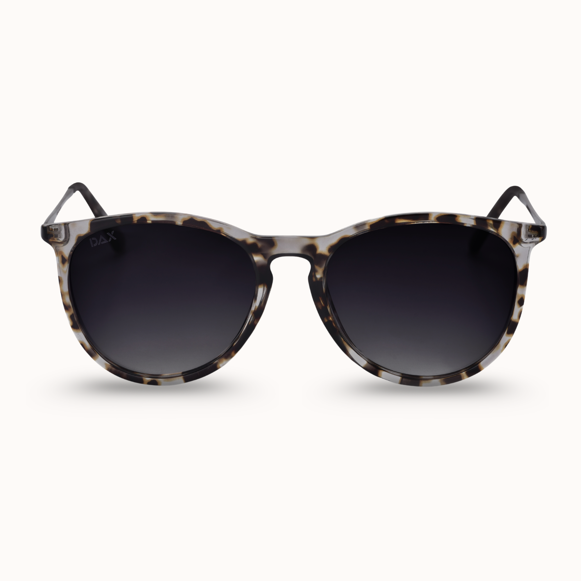 Sunglasses with tortoiseshell frame and dark lenses on a white background