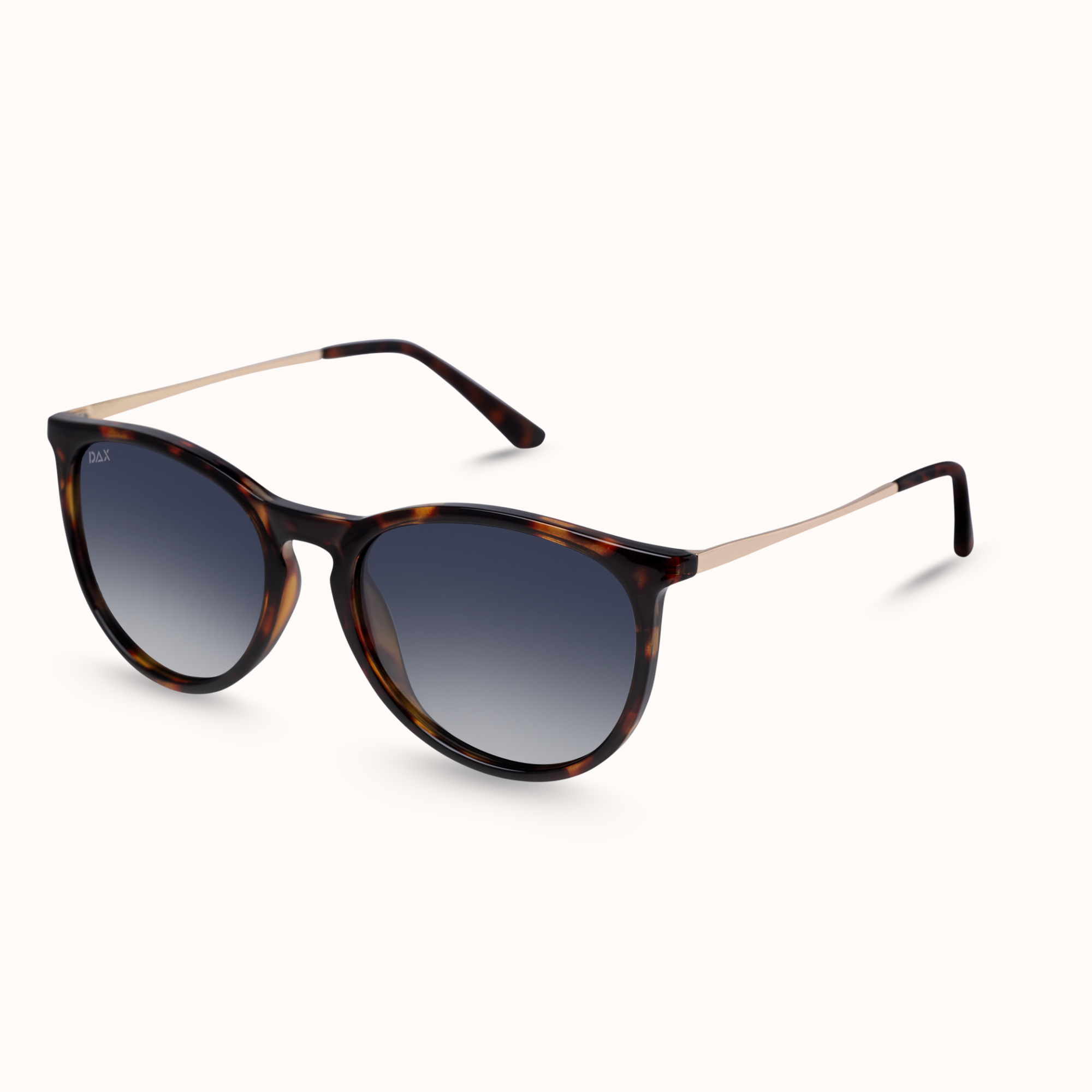 Tortoiseshell sunglasses with a gradient gray lens and slim rose gold metal temples, shown on a clean off-white background.