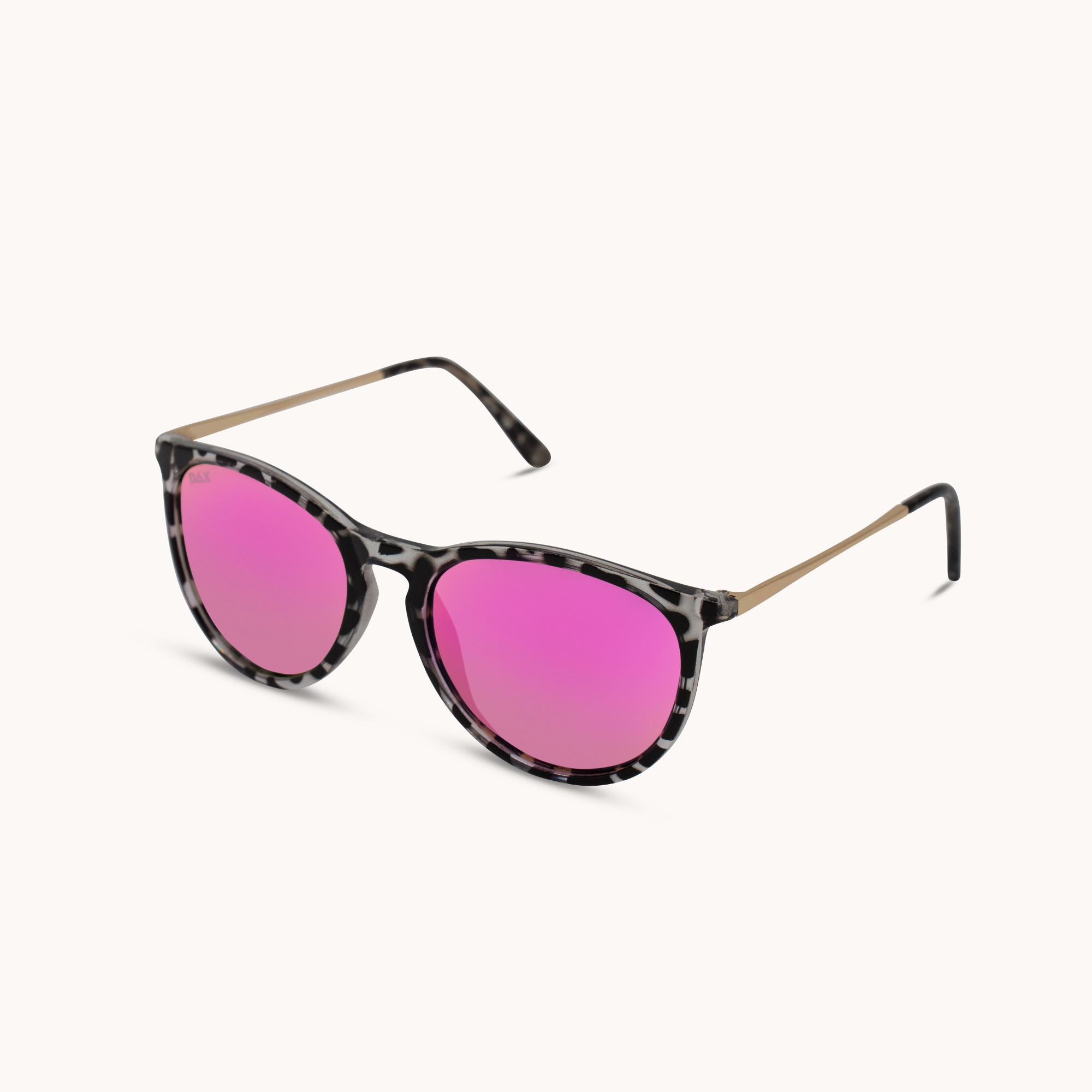 Sunglasses with pink lenses and tortoiseshell frame on a white background