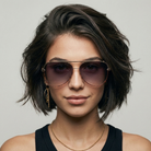 Woman wearing sunglasses with a neutral background