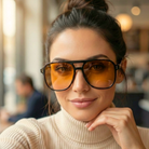 Woman wearing large sunglasses with a blurred background