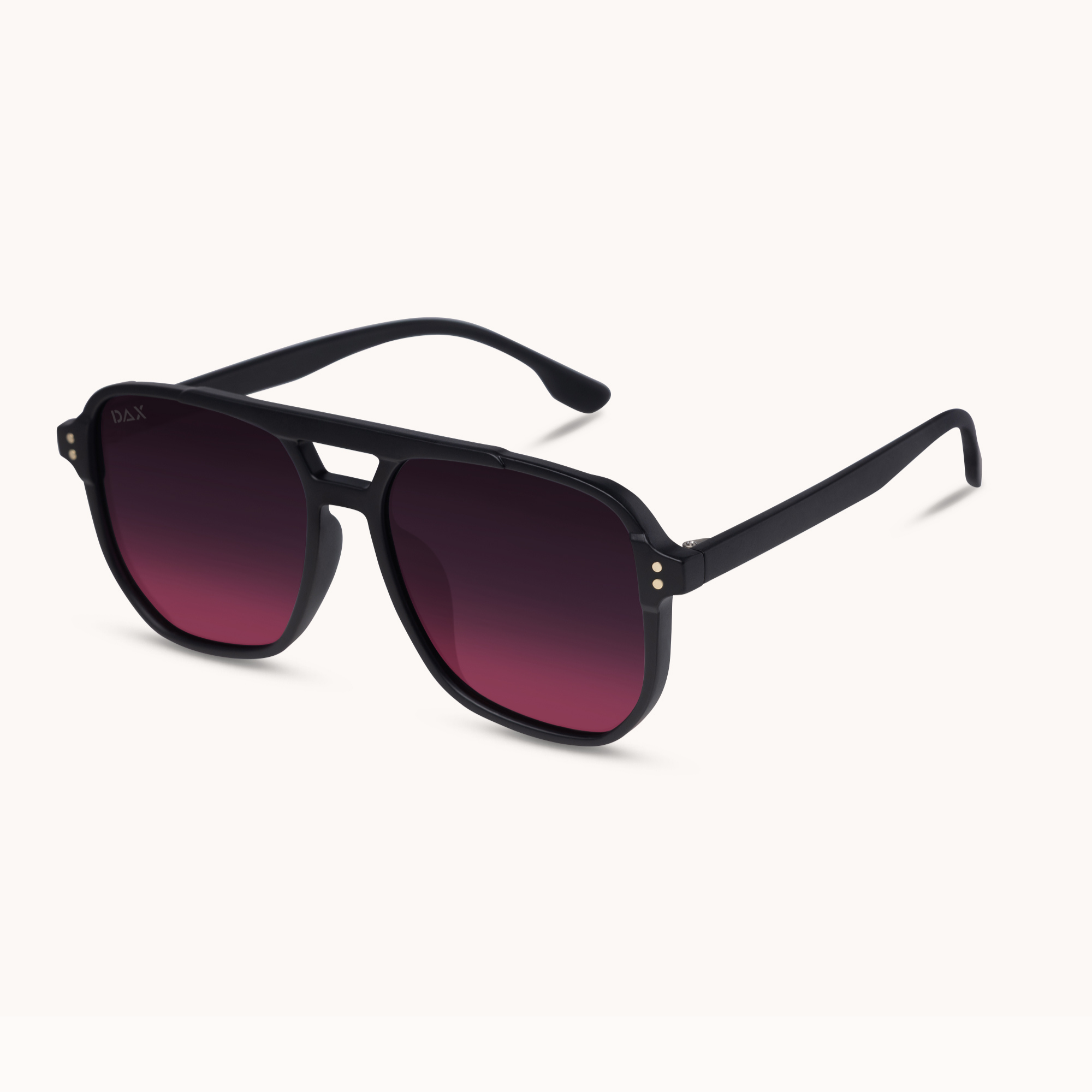 A pair of black aviator-style sunglasses with dark gradient lenses, shown at an angle on a clean off-white background.