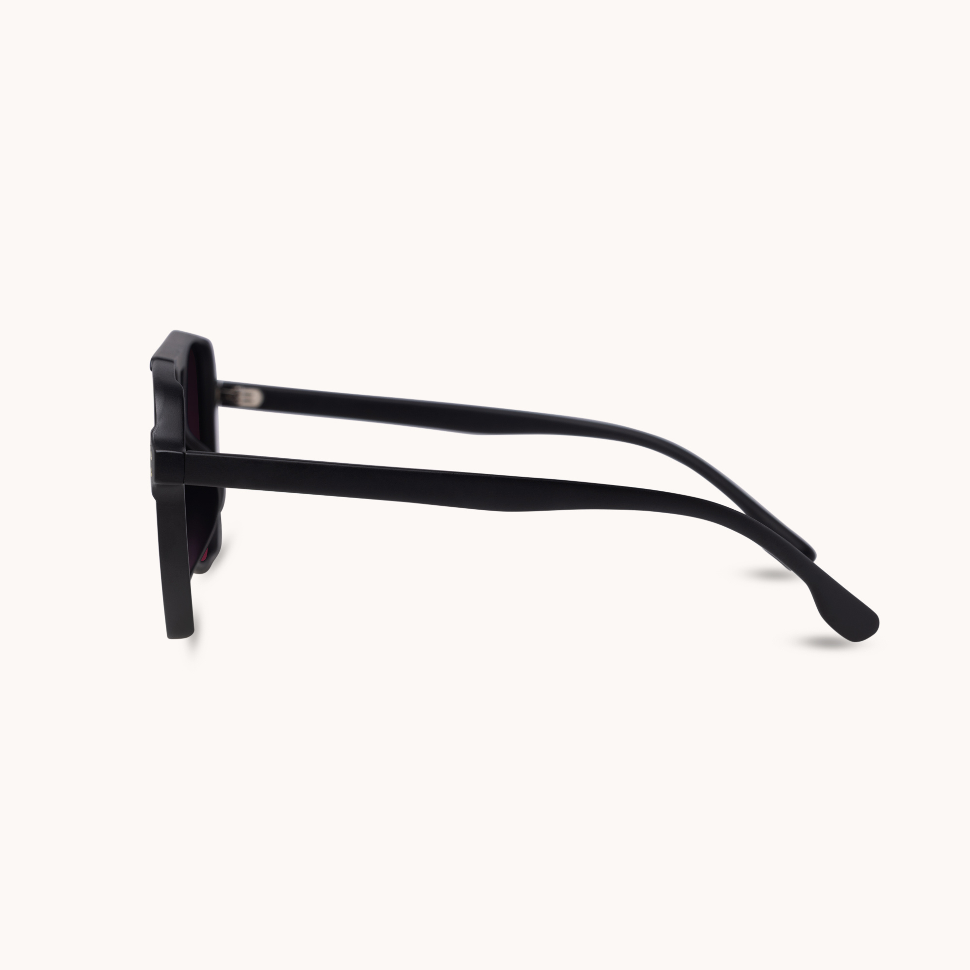 Sunglasses with black frame and dark lenses on a white background